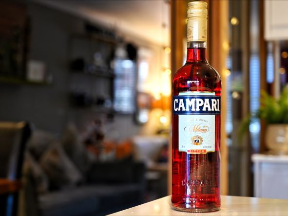 a bottle shot on a counter in a home bar