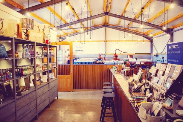 deerness distillery showing shelves stocked with various spirit bottles