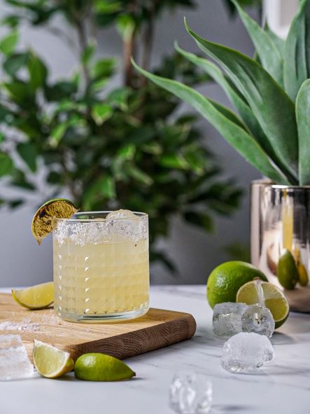 a margarita garnished with burnt lime