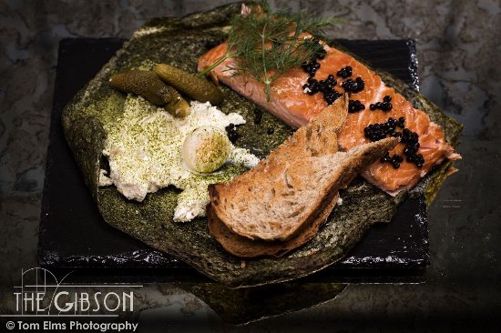 roasted salmon and bread on a rustic plate