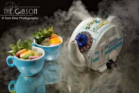 a smoking cocktail in elaborate barware